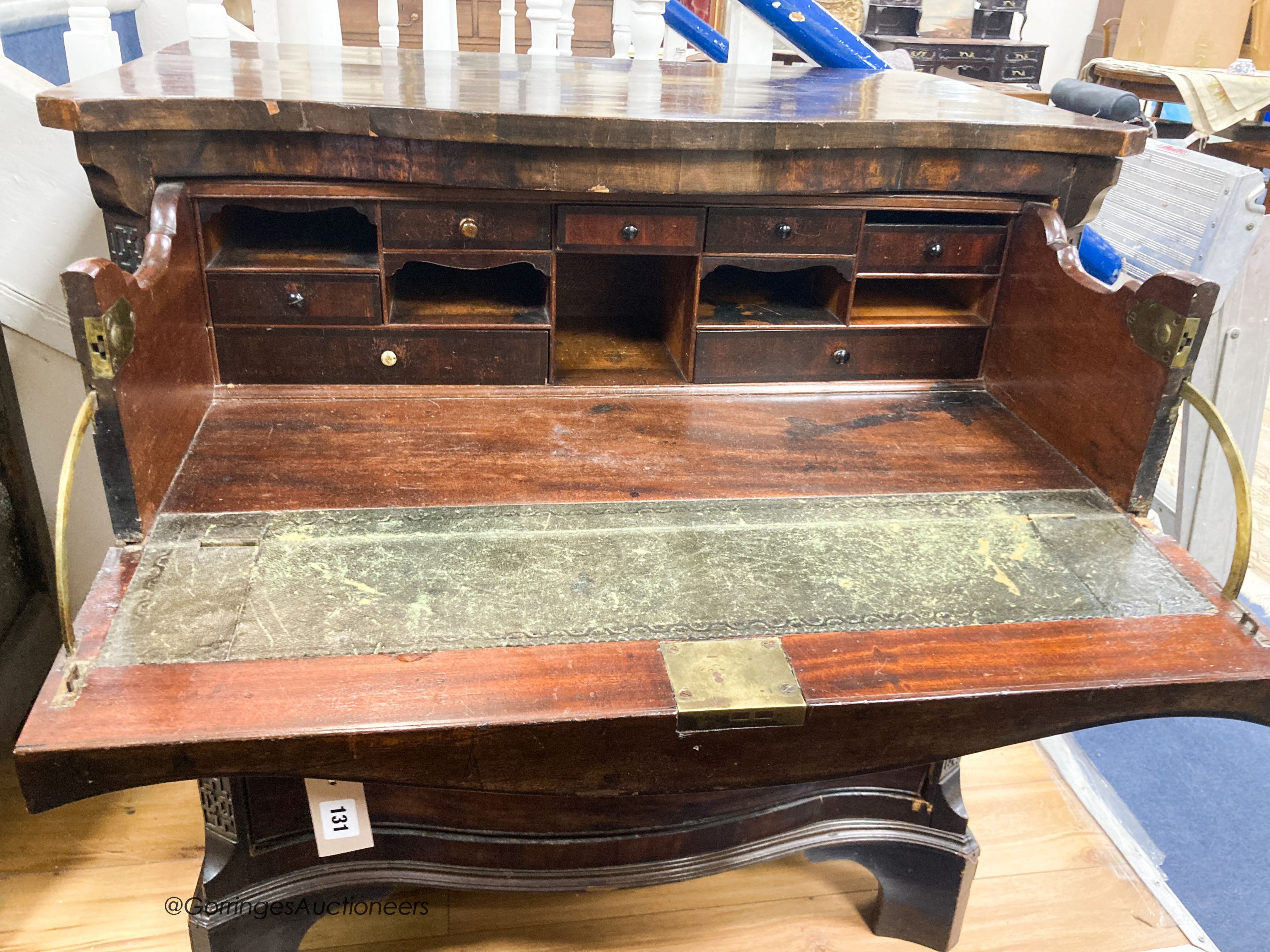 A George III style mahogany serpentine secretaire chest, width 87cm, depth 56cm, height 96cm
